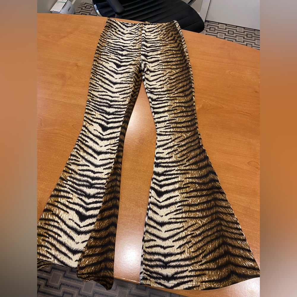 Highly sought after pants. Always sells out. Tiger/Apricot pants. Flare.